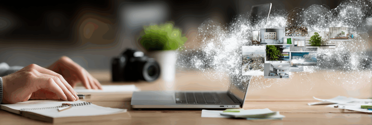 Hands resting near a notebook on a desk with a laptop open, as glowing network-like connections emerge from the screen carrying floating images—symbolizing AI, creativity, and collaborative discovery.