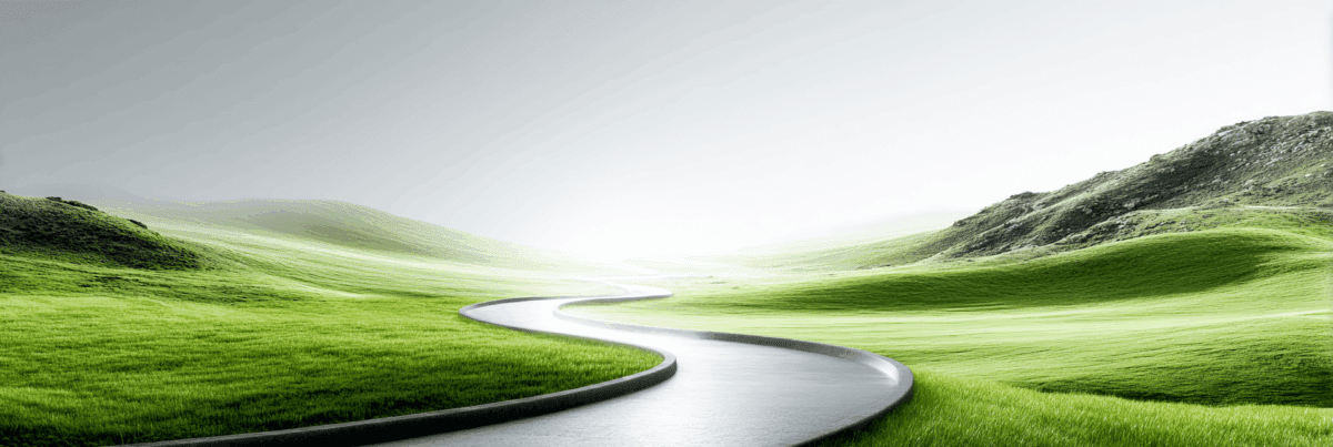 A long winding path curves through bright green hills toward a soft, glowing horizon. The landscape is calm and open, with gentle slopes and a pale sky.