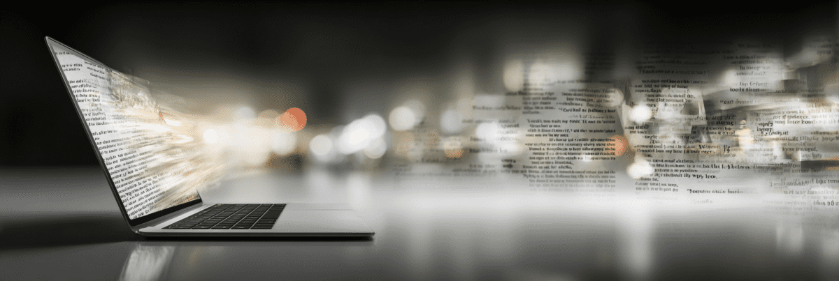 Laptop with glowing screen as layers of blurred text extend outward, creating a sense of depth and continuous flow.